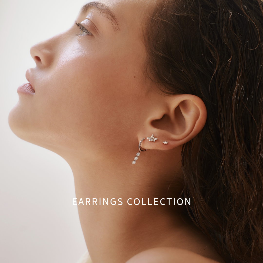 דוגמנית עם שילוב עגילים ועגילי פירסינג מזהב משובצים יהלומים טבעיים מקולקציית GLO