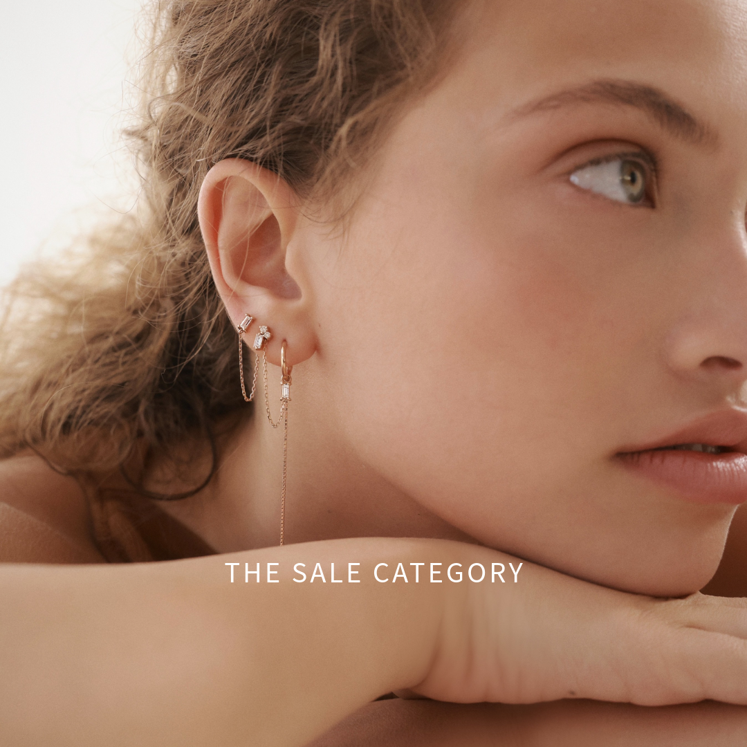 דוגמנית עם תכשיטי זהב משובצים יהלומים טבעיים מתוך קטגוריית הסייל של GLO