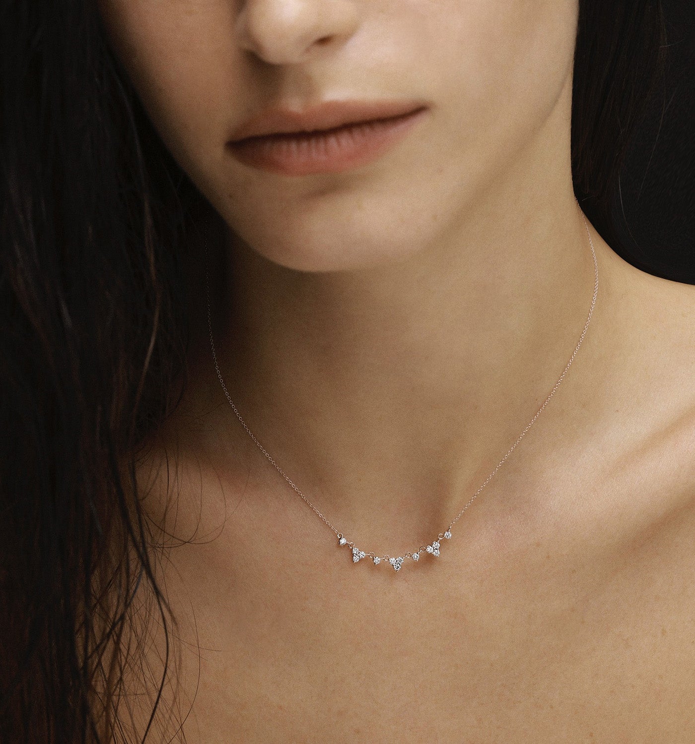 Lany necklace in yellow gold set with natural diamonds worn on a model’s neck