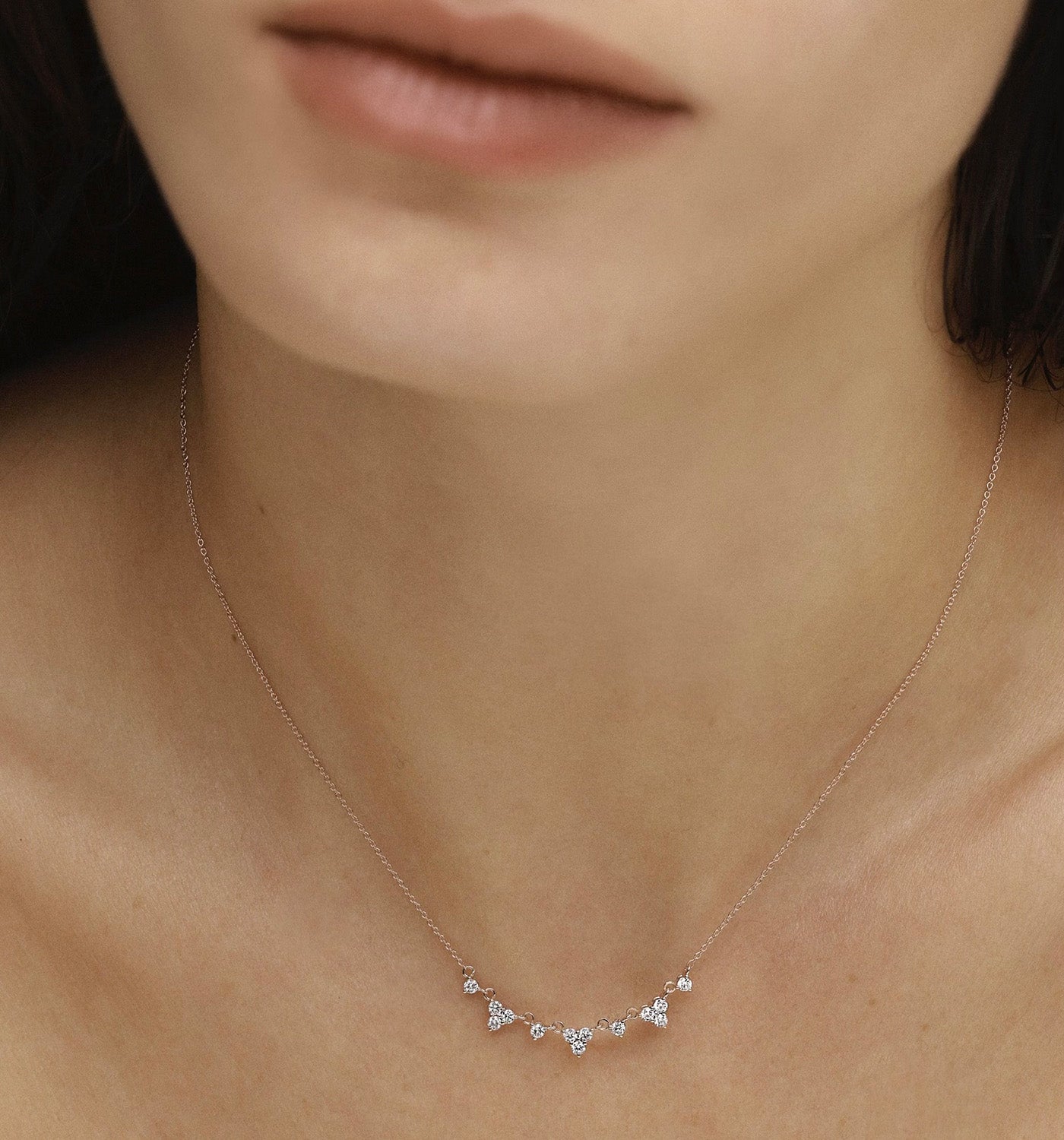 Lany necklace in yellow gold set with natural diamonds worn on a model’s neck