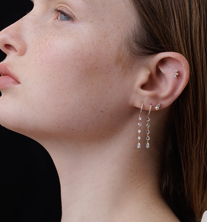 MINI TRIO AND PEARL PIERCING LABRET in rose gold set with a pearl and natural diamonds worn on a model 2