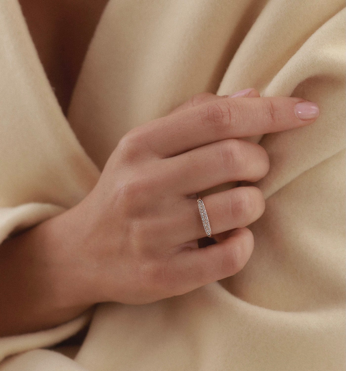 Victoria signet ring in rose gold set with natural diamonds worn on a model hand