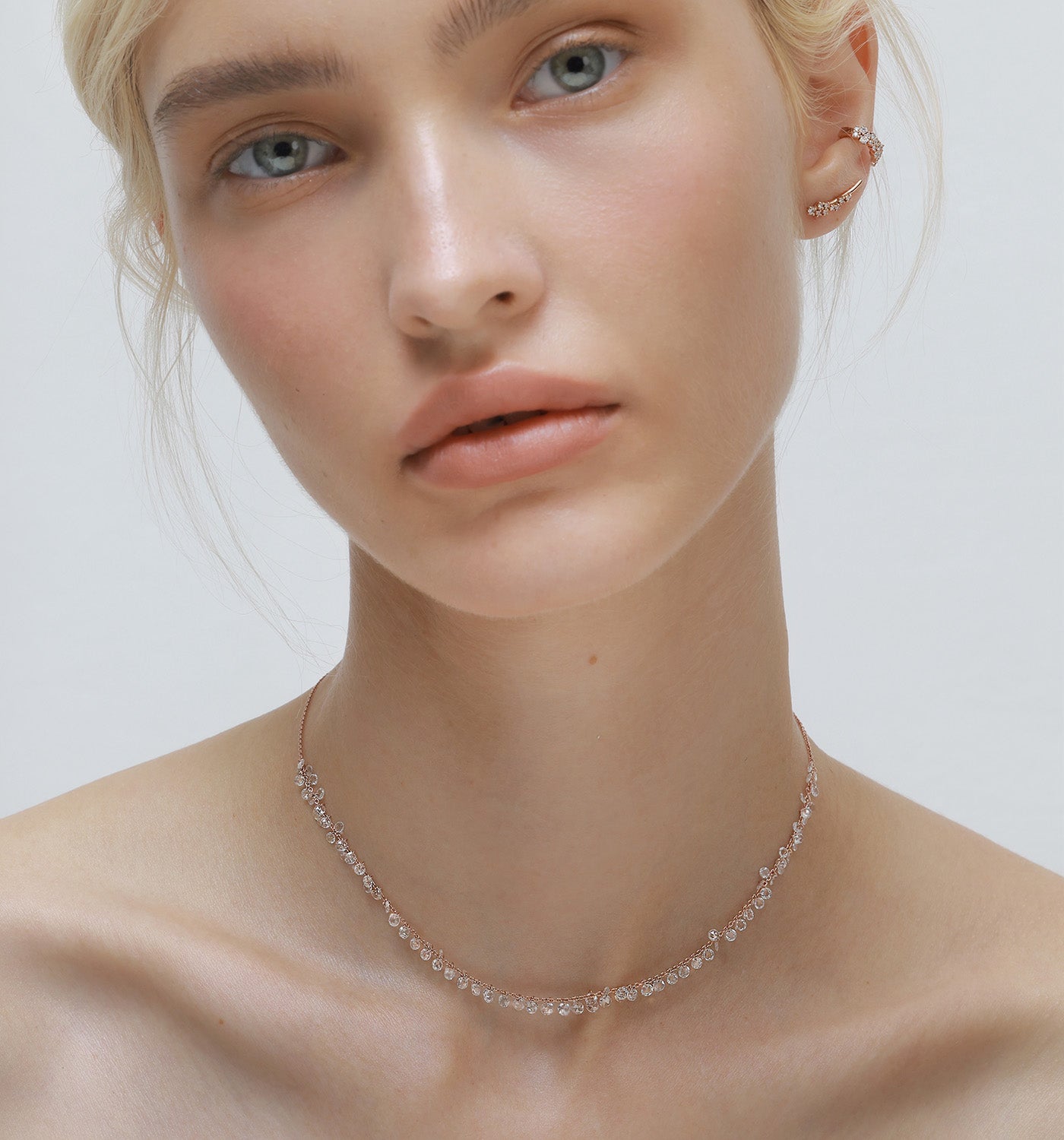 Brigitte More floating necklace in rose gold set with rose cut natural diamonds worn on a model
