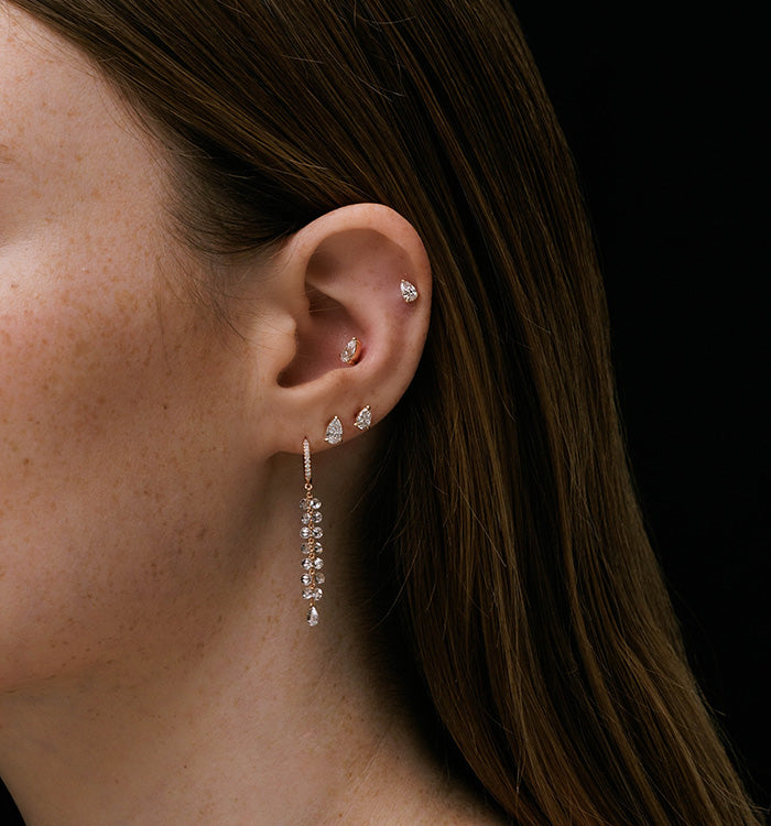 BRIGITTE EARRING hoop earring in rose gold set with floating natural diamonds and floating natural rose cut diamonds worn on a model image 3