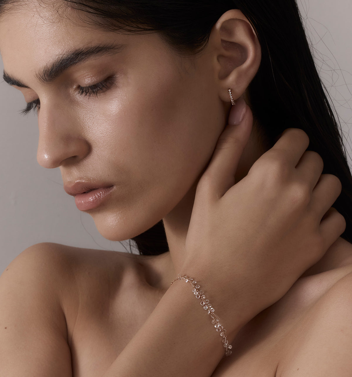 CROWN ROUND DIAMONDS HOOP 12mm hoop earring in rose gold set with natural diamonds worn on a model