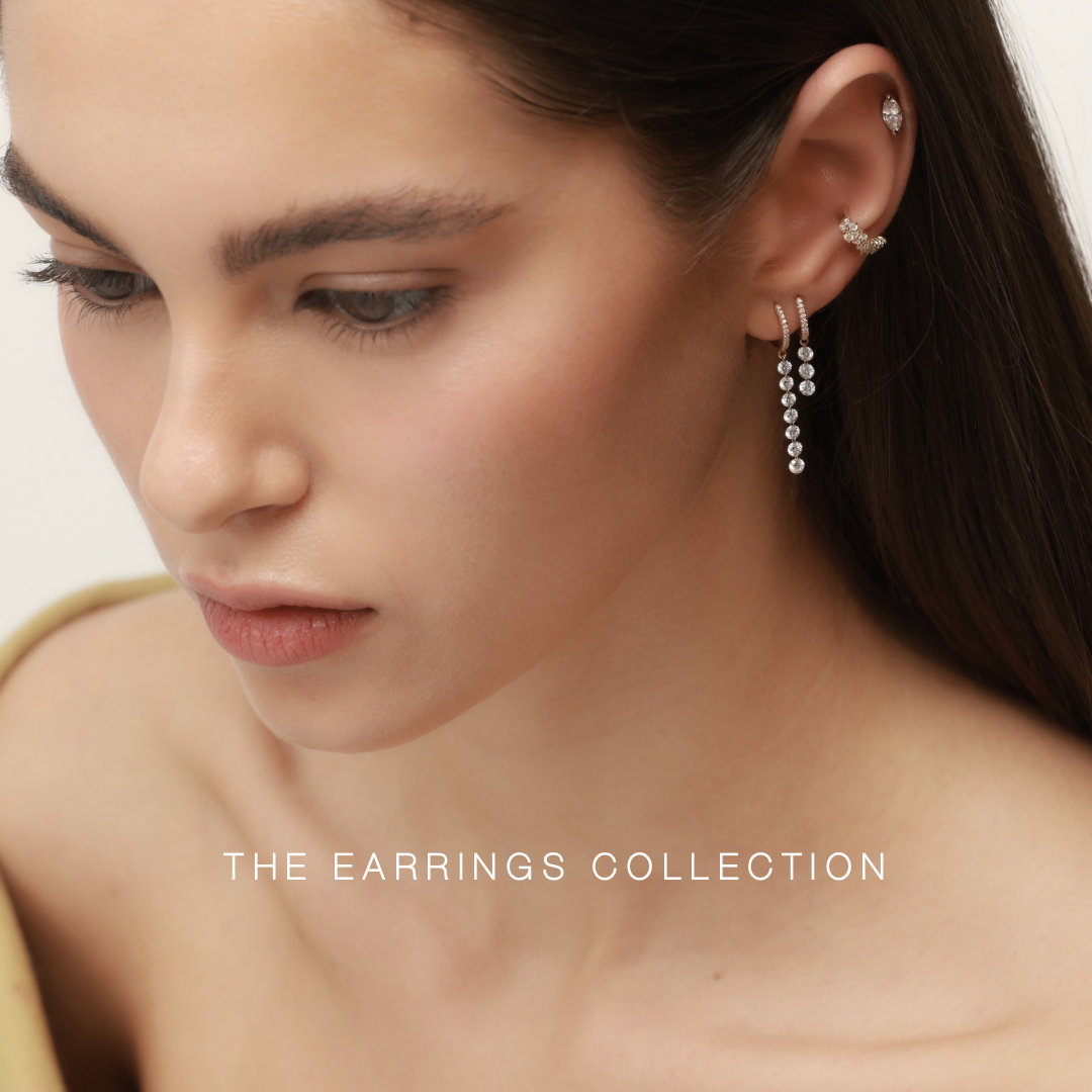 Model wearing gold earrings set with natural diamonds linking to the earrings category