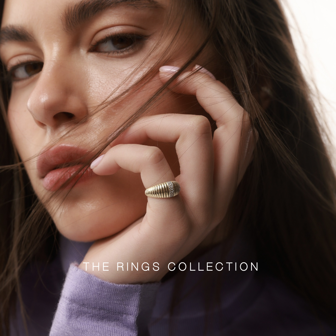 Mila diamond ring in gold set with natural diamonds worn on a model linking to the rings category
