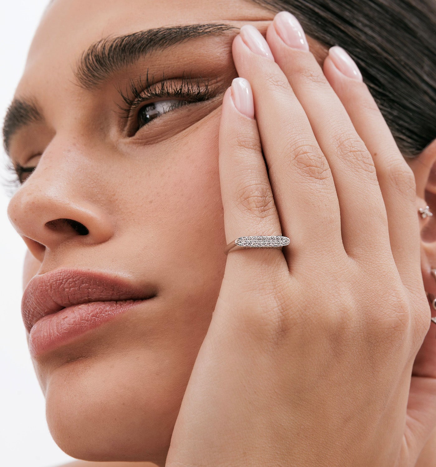 Victoria pinky signet ring in yeloow gold set with natural diamonds worn on a model hand second view