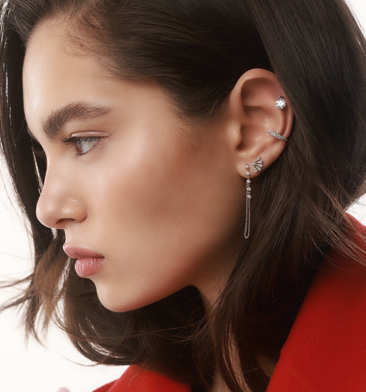 Vivi Diamonds stud earring in rose gold set with natural diamonds worn on a model’s ear